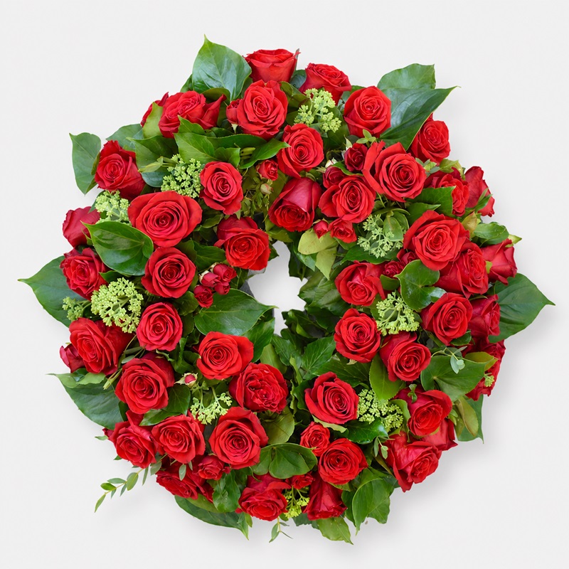 coroana funerara rotunda cu trandafiri si miniroze rosii